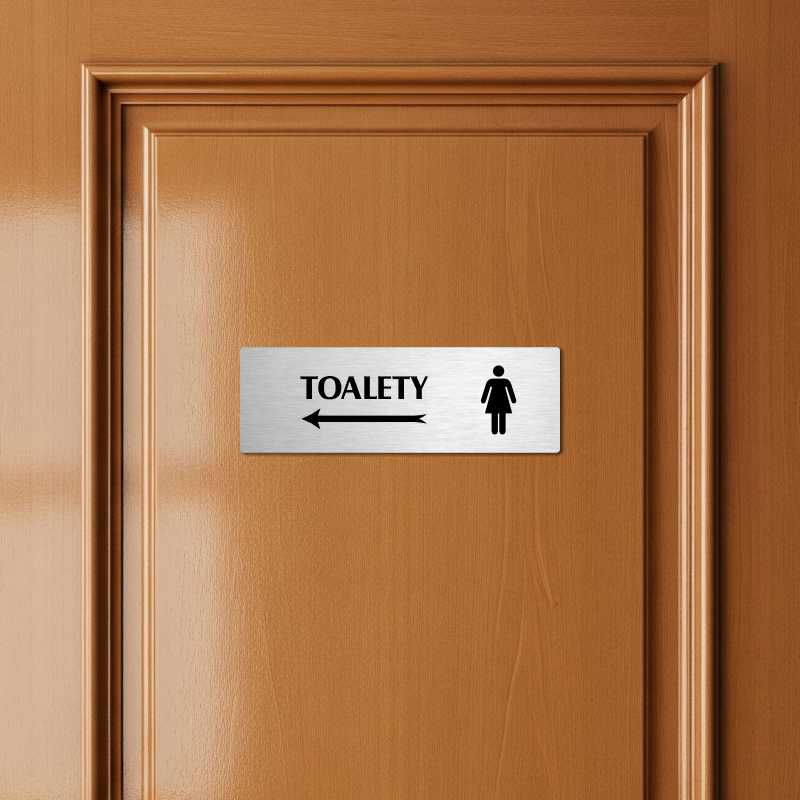 Toalety vlevo ženy, 200x66mm, zlatá popiska s dvojtým rámečkem